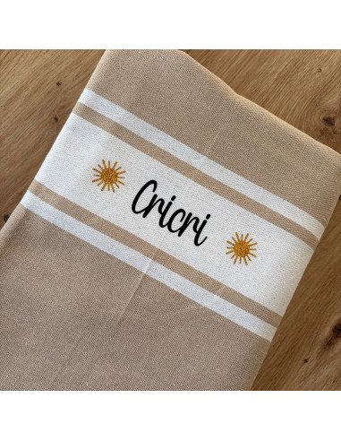 Fouta de plage BEIGE prénom noir + logo SOLEIL...